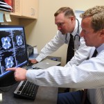 Dr. Crawford and Dr. MacKenzie consulting on a case